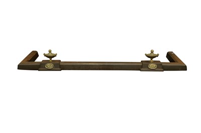 Lot 211 - AN EDWARDIAN REGENCY STYLE STEEL FENDER