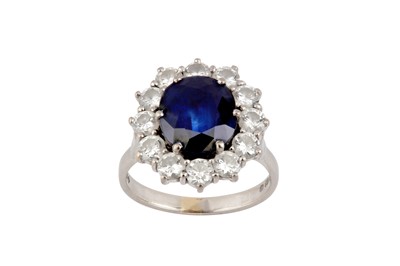 Lot 47 - A sapphire and diamond cluster ring, 1980