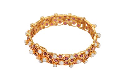 Lot 101 - A pearl and amethyst bangle