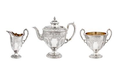 Lot 406 - A Victorian sterling silver three-piece tea service, London 1871/74 by Martin Hall and Co