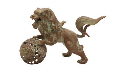 Lot 259 - A CHINESE CAST BRONZE LION