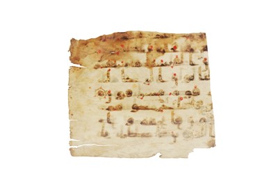 Lot 120 - A FRAGMENT OF A LOOSE KUFIC QUR'AN FOLIO