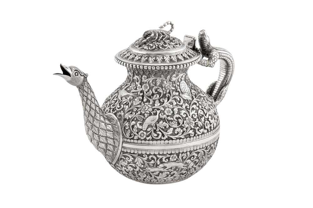 Lot 228 - A fine late 19th century Anglo – Indian silver teapot, Cutch, Bhuj circa 1880 by Oomersi Mawji (active 1860-90)