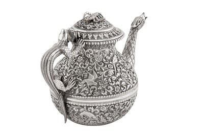 Lot 228 - A fine late 19th century Anglo – Indian silver teapot, Cutch, Bhuj circa 1880 by Oomersi Mawji (active 1860-90)