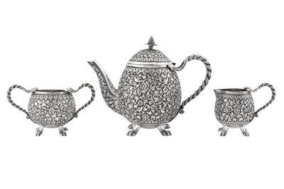 Lot 225 - A late 19th century Anglo – Indian unmarked silver three-piece bachelor tea service, Cutch circa 1890