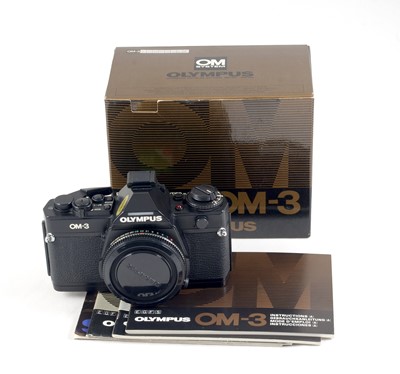 Lot 99 - A Boxed Olympus OM-3 Film Camera.
