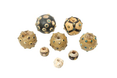 Lot 12 - A GROUP OF EIGHT CHINESE GLASS 'EYE' BEADS
