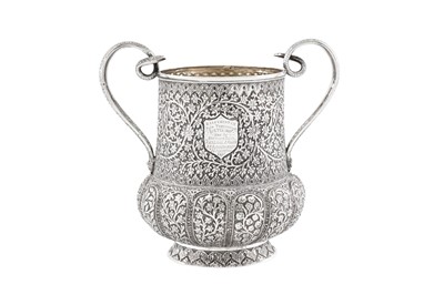 Lot 157 - A late 19th century Anglo – Indian unmarked silver twin handled cup, Kashmir dated 1887