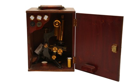 Lot 145 - W WATSON & SONS; AN EDWARDIAN MONOCULAR BRASS MICROSCOPE DATING FROM 1906-1909