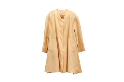 Lot 493 - A CHRISTIAN DIOR COURDONNES PALE YELLOW CAPE COAT