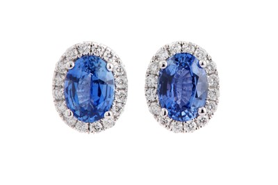 Lot 147 - A pair of sapphire and diamond cluster earstuds