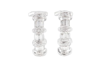 Lot 113 - A pair of diamond earrings