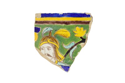Lot 230 - A SAFAVID CUERDA SECA POTTERY TILE FRAGMENT