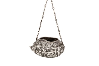 Lot 145 - A PAHLAVI SILVER REPOUSSÉ KASHKUL BEGGING BOWL