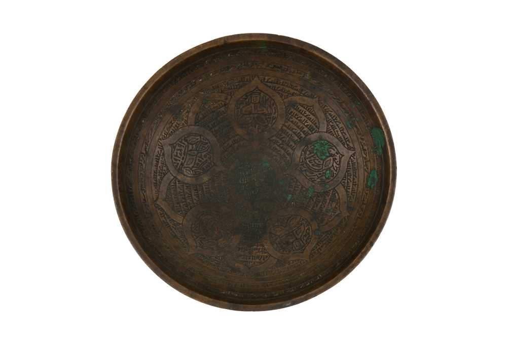Lot 126 - AN AYYUBID ENGRAVED COPPER 'MAGIC' BOWL