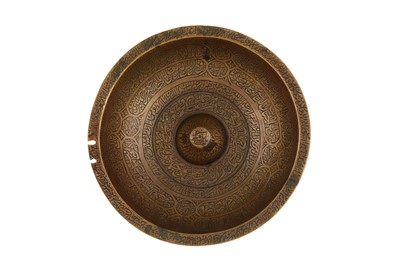 Lot 166 - A QAJAR ENGRAVED BRASS 'MAGIC' BOWL