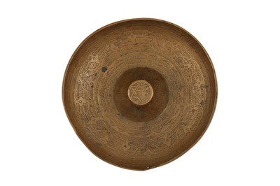 Lot 124 - AN ENGRAVED BRASS 'MAGIC' BOWL WITH PSEUDO-SYRIAC INSCRIPTIONS