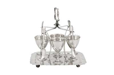 Lot 363 - A George V sterling silver egg cruet, Sheffield 1910 by Walker and Hall