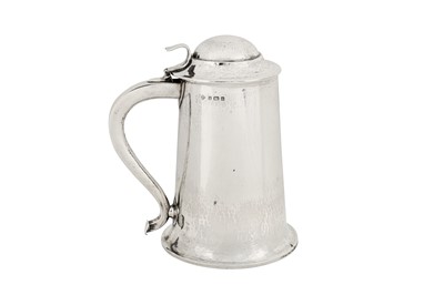 Lot 248 - An Edwardian ‘Arts and Crafts’ sterling silver tankard, Birmingham 1904 by Birmingham Guild of Handicraft Ltd