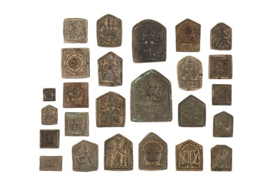Lot 425 - TWENTY-FIVE BRASS DECORATIVE MOULDS FOR TALISMANS WITH HINDU DEITIES