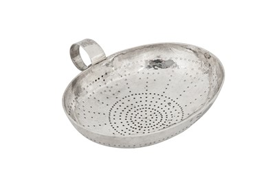 Lot 449 - A George III provincial sterling silver ‘West Country’ lemon strainer Exeter circa 1770 by Jason Holt of Plymouth
