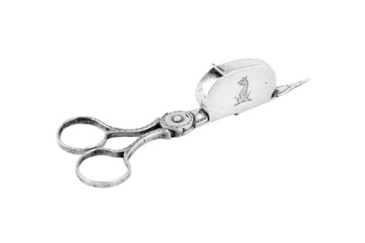 Lot 470 - A George III sterling silver chamberstick pair of snuffers / wick trimmer, London 1778 by John Booth