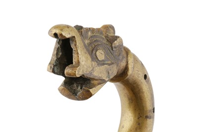Lot 269 - A CAST AND PIERCED BRASS DOOR ELEMENT