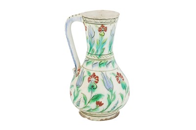 Lot 389 - AN IZNIK POTTERY JUG