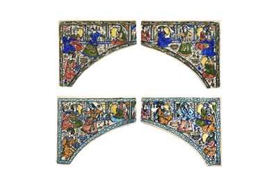 Lot 16 - FOUR MOULDED AND POLYCHROME-PAINTED QAJAR-REVIVAL POTTERY TILES