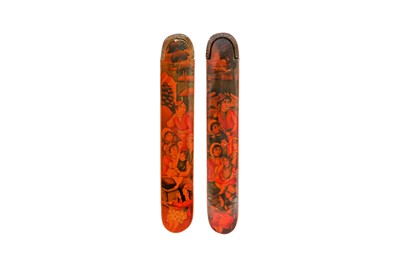 Lot 26 - TWO LACQUERED PAPIER-MÂCHÉ PEN CASES (QALAMDAN) WITH PORTRAITS OF QAJAR MAIDENS ATTENDING A CHILD