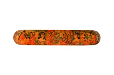 Lot 23 - A QAJAR LACQUERED PAPIER-MÂCHÉ PEN CASE (QALAMDAN) WITH FIGURAL DECORATION