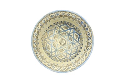 Lot 5 - A KASHAN COBALT BLUE AND BLACK-PAINTED POTTERY BOWL WITH SIX-POINTED STAR DESIGN