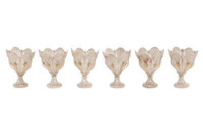 Lot 134 - A SET OF SIX PARCEL-GILT SILVER FILIGREE ZARF CUPS