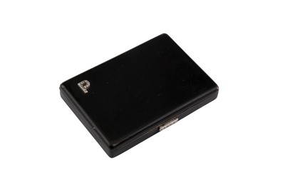 Lot 67 - Cartier | A black enamel and diamond compact, 1934