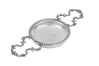 Lot 481 - An early George III sterling silver lemon strainer, London 1762 by Samuel Herbert and Henry Bailey (reg. 6th Nov 1750)
