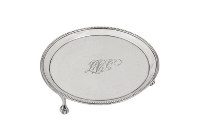 Lot 457 - A George III sterling silver coffee pot stand, London 1787 by Thomas Liddiard (reg. 3rd March 1770) overstriking Hester Bateman