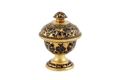 Lot 263 - A CHAMPLEVÉ BLACK-ENAMELLED PARCEL-GILT LIDDED STEM CUP