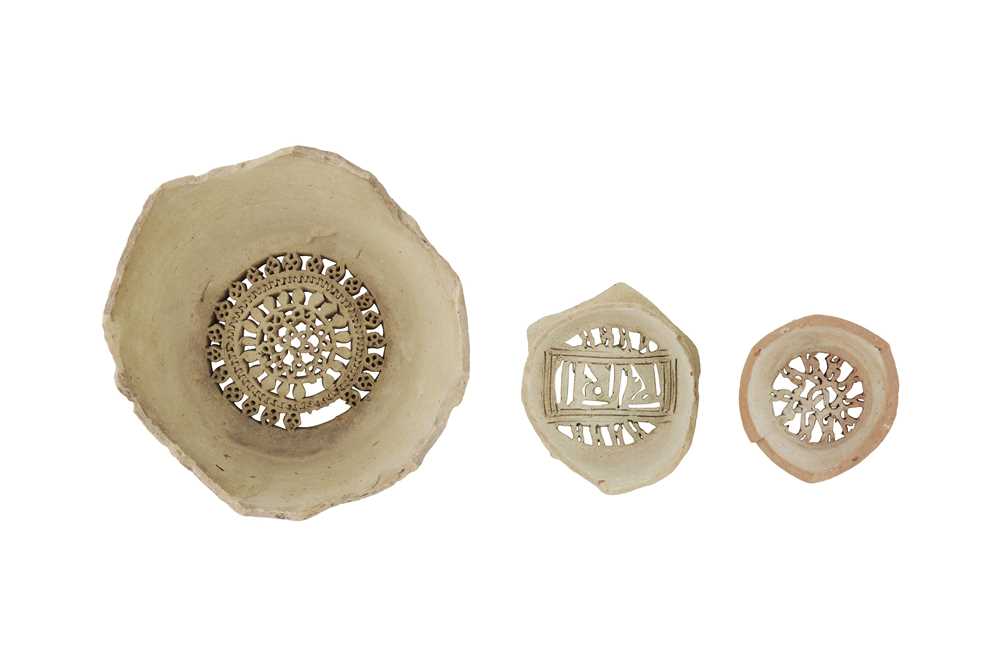 Lot 104 - THREE UNGLAZED EARTHENWARE WATER JUG FILTERS