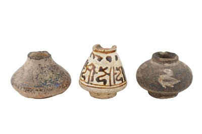 Lot 110 - THREE MINIATURE POTTERY JARS WITH AVIARY MOTIFS AND PSEUDO-CALLIGRAPHY