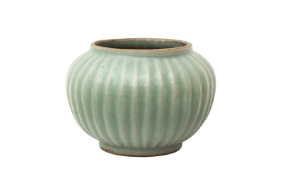 Lot 849 - A CHINESE CELADON-GLAZED RIBBED JAR