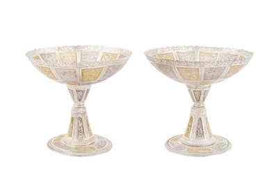 Lot 140 - AN ELEGANT PAIR OF QAJAR PARCEL-GILT SILVER FILIGREE COMPORTS