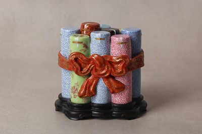 Lot 180 - A CHINESE FAMILLE-ROSE TROMPE L'OEIL 'FIRECRACKER' BOX AND COVER