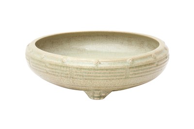 Lot 194 - A CHINESE CELADON-GLAZED 'EIGHT TRIGRAMS' TRIPOD CENSER