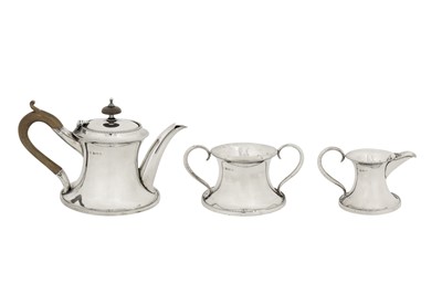 Lot 307 - An Edwardian sterling silver three-piece bachelor tea service, Birmingham 1908 by Charles S Green and Co