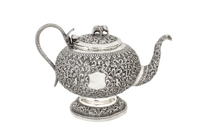 Lot 114 - An early 20th century Anglo – Indian unmarked silver teapot, Cutch circa 1910
