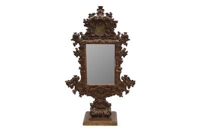 Lot 214 - AN UNUSUAL 18TH CENTURY AND LATER ITALIAN CARVED GILTWOOD FREESTANDING MIRROR