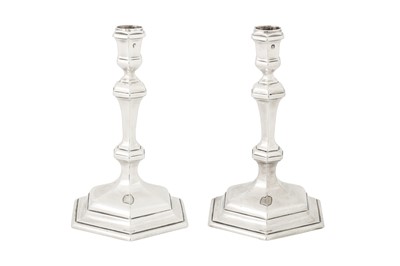 Lot 473 - A pair of George I Britannia standard silver candlesticks, London 1718 by William Lukin I (reg. 31st July 1699)