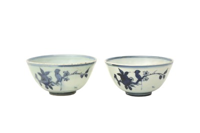 Lot 28 - A PAIR OF CHINESE BLUE AND WHITE 'BIRD AND PEACH' BOWLS