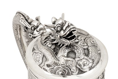 Lot 161 - A large late 19th century Chinese Export silver lidded mug or tankard, Canton circa 1880 by Qiu Ji, retailed by Lee Ching of Canton and later Hong Kong