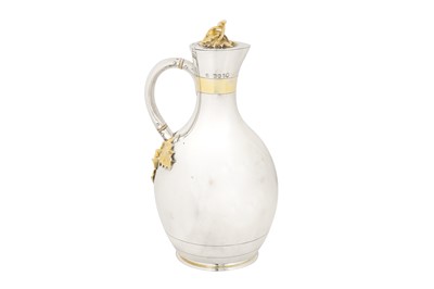 Lot 345 - A Victorian parcel gilt sterling silver claret jug, London 1866 by George Fox